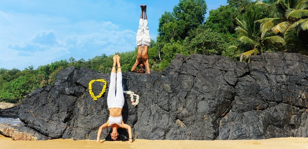headstand at the beach in gokarna