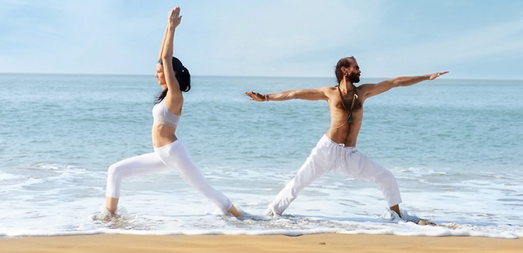 strenghtening of leg muscles with warrior asana posture, yoga at the beach, shree hari yoga center