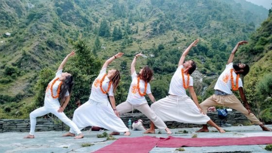 warrior posing in the himalayas from shree hari yoga students in rishikesh