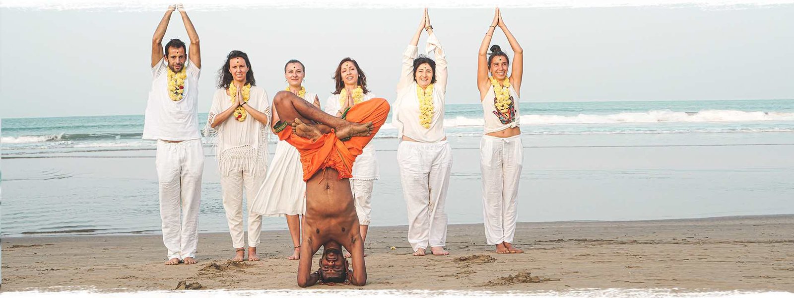 beach-headstand-group | Yoga Teacher Training in India at Shree Hari School | Certified YTT course yoga at the beach