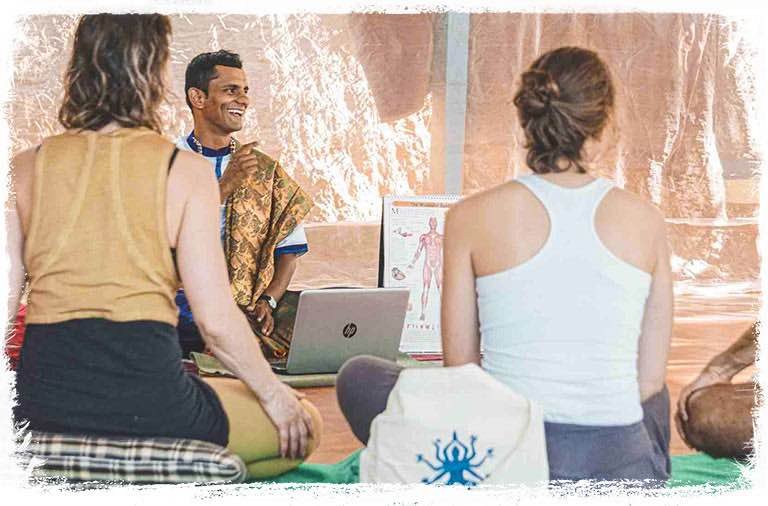 shy_row_bg1_mobile | Yoga Teacher Training in India at Shree Hari School | Certified YTT course yoga anatomy teacher with students laughing