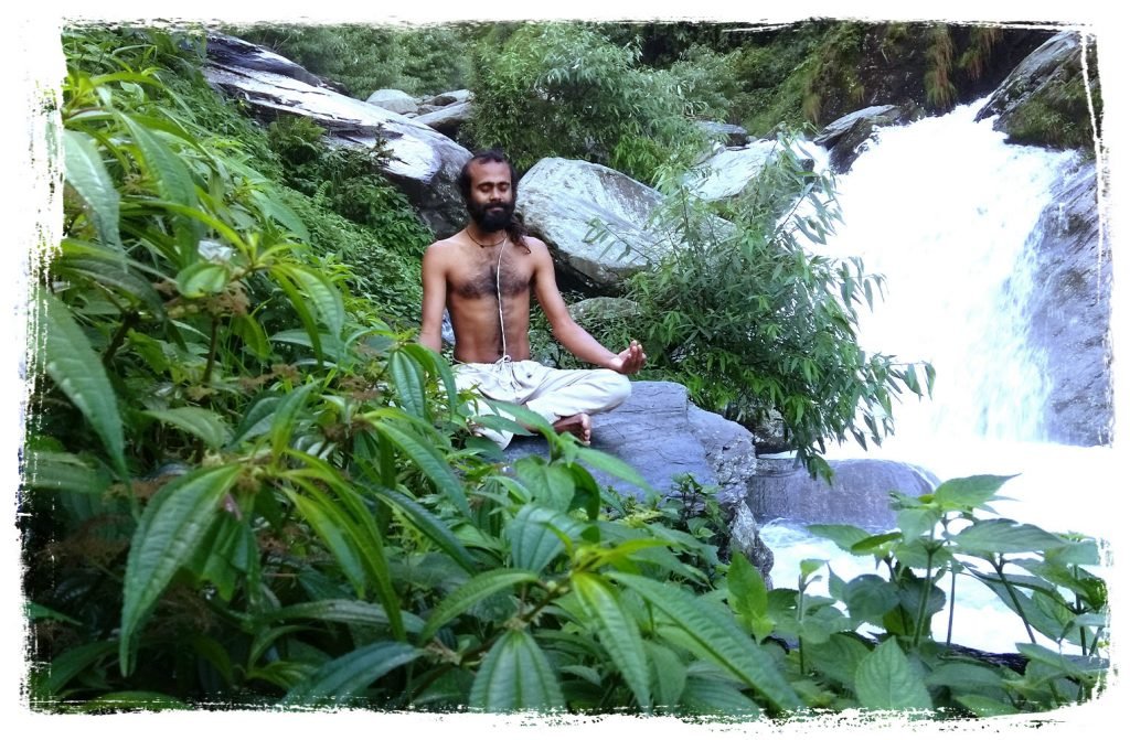 hari-waterfall | Yoga Teacher Training in India at Shree Hari School | Certified YTT course yoga teacher is meditating at the waterfall