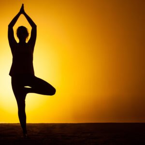 The woman practicing yoga in the sunset light | Yoga Teacher Training in India at Shree Hari School | Certified YTT course